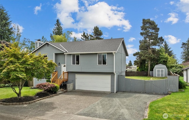 11620 28th St NE, Lake Stevens, WA 98258 - split foyer home featuring a storage unit, driveway, an attached garage, and roof with shingles
