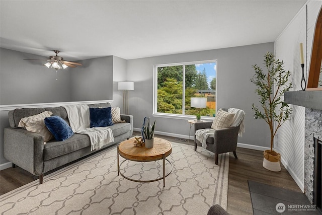 11620 28th St NE, Lake Stevens, WA 98258 - living room with wood finished floors, ceiling fan, and a fireplace