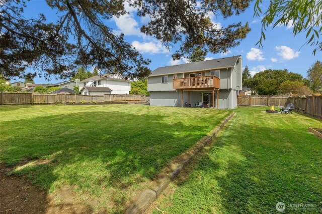 11620 28th St NE, Lake Stevens, WA 98258 - back of property with an outdoor fire pit, a fenced backyard, and a deck