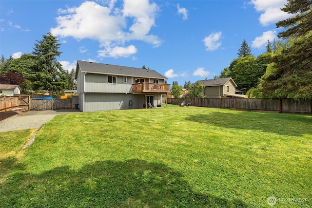 11620 28th St NE, Lake Stevens, WA 98258 - back of house with a fenced backyard, a wooden deck, and a gate