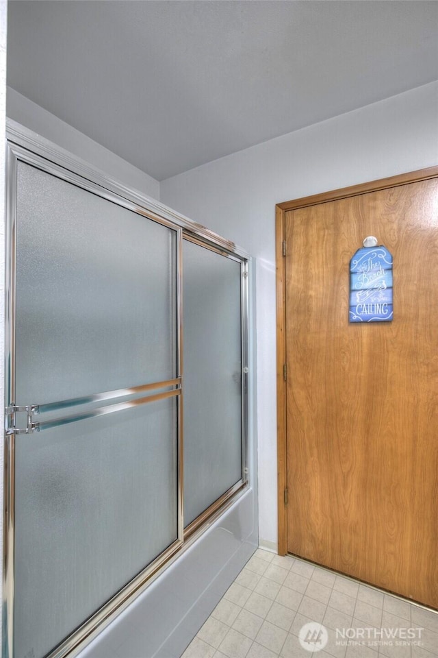 208 N Broadway St, Westport, WA 98595 - full bath with tile patterned flooring and bath / shower combo with glass door