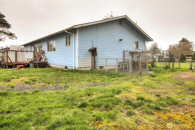208 N Broadway St, Westport, WA 98595 - rear view of house featuring a deck and crawl space