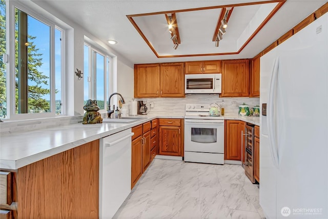 7400 Stinson Ave Unit 315, Gig Harbor, WA 98335 - kitchen with white appliances, a sink, light countertops, and light marble finish floors
