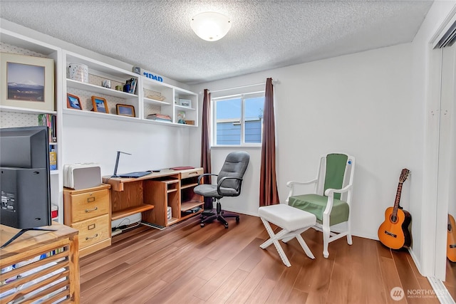 7400 Stinson Ave Unit 315, Gig Harbor, WA 98335 - home office with a textured ceiling and wood finished floors