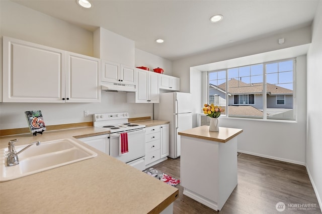 2300 Benson Rd S Unit D3, Renton, WA 98055 - kitchen featuring white appliances, under cabinet range hood, a sink, white cabinets, and recessed lighting
