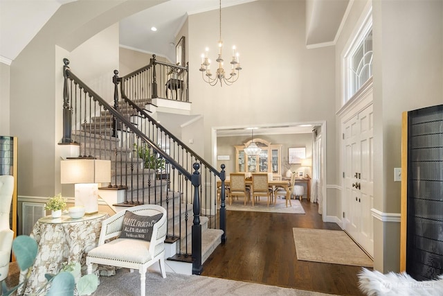 21505 30th Ave SE, Bothell, WA 98021 - entryway featuring a high ceiling, a chandelier, stairway, arched walkways, and wood finished floors