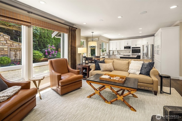 21505 30th Ave SE, Bothell, WA 98021 - living room featuring healthy amount of natural light, ornamental molding, recessed lighting, light wood-type flooring, and baseboards
