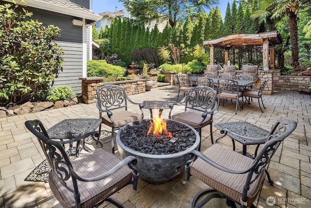 21505 30th Ave SE, Bothell, WA 98021 - view of patio with an outdoor fire pit, outdoor dining space, and a pergola