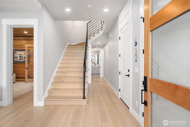 17281 SE 43rd St, Bellevue, WA 98006 - foyer entrance with light wood-style floors, stairs, baseboards, and recessed lighting