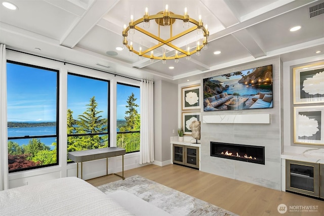 17281 SE 43rd St, Bellevue, WA 98006 - bedroom featuring coffered ceiling, wood finished floors, a chandelier, a tiled fireplace, and baseboards