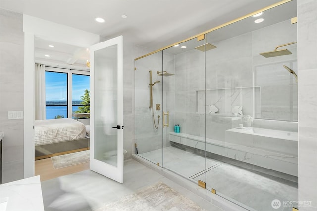 17281 SE 43rd St, Bellevue, WA 98006 - bathroom with connected bathroom, a shower stall, recessed lighting, a water view, and french doors