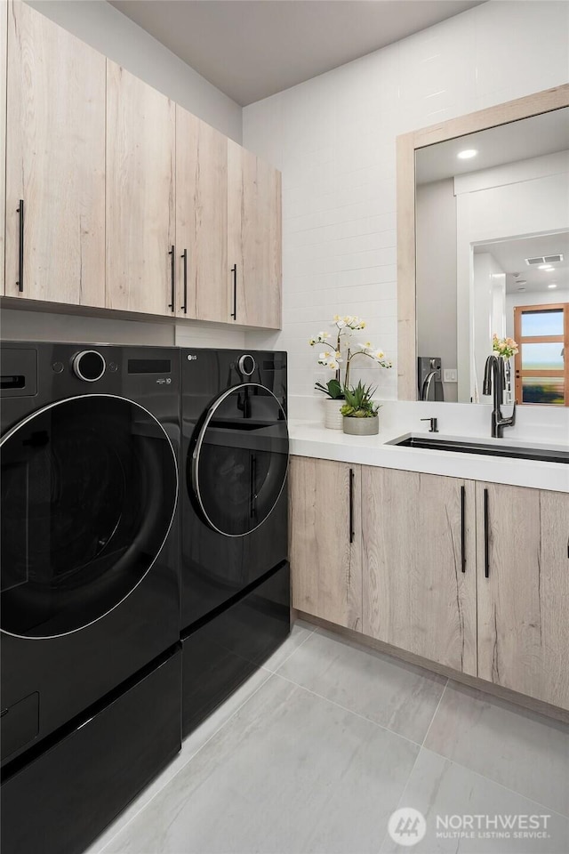 17281 SE 43rd St, Bellevue, WA 98006 - washroom featuring washing machine and dryer and cabinet space