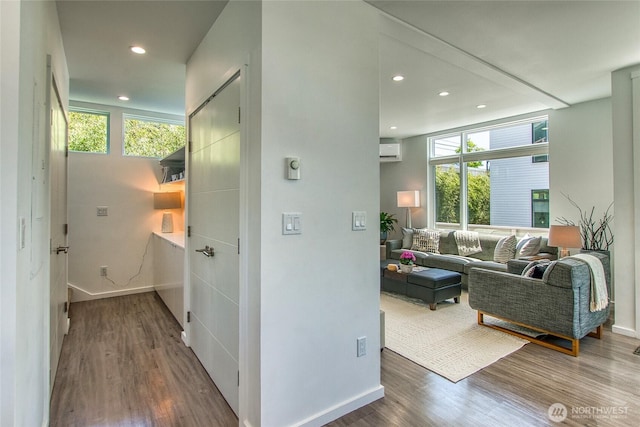 430 Prune Aly Unit B, Orcas Island, WA 98245 - hallway with a wall mounted air conditioner, wood finished floors, recessed lighting, and baseboards