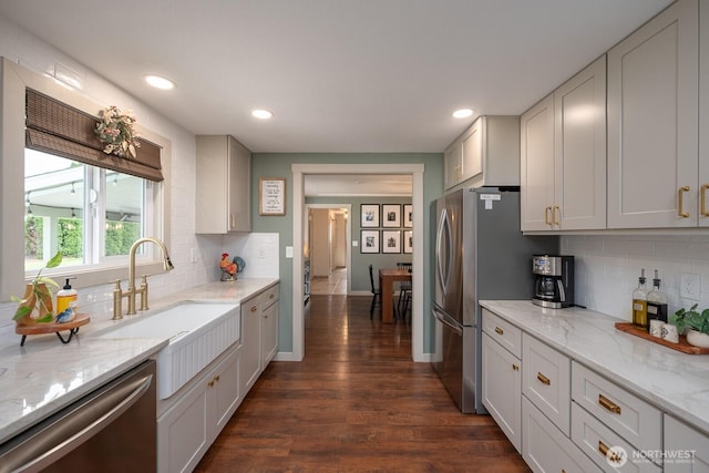 12009 NW Dodson Rd, Ephrata, WA 98823 - kitchen with stainless steel appliances, a sink, dark wood-style floors, decorative backsplash, and recessed lighting