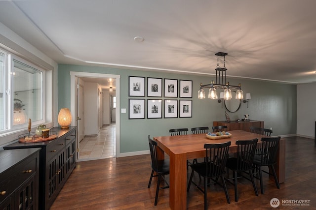 12009 NW Dodson Rd, Ephrata, WA 98823 - dining room featuring dark wood-style flooring and baseboards