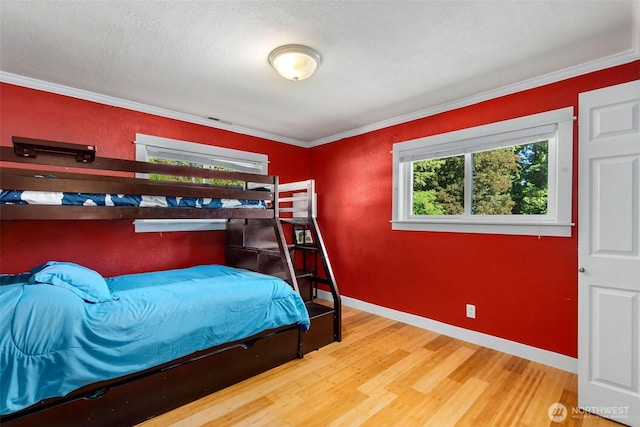 8827 Marlene Ct SW, Olympia, WA 98512 - bedroom with wood finished floors, crown molding, and baseboards
