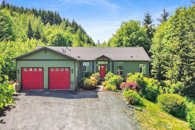 1055 Falls Dr, Bellingham, WA 98229 - view of front facade featuring a garage and asphalt driveway