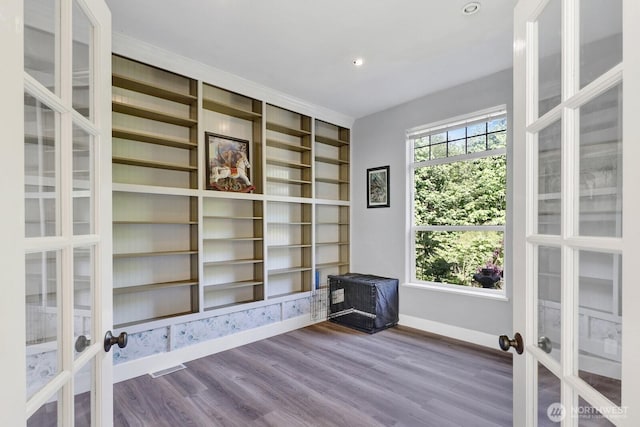 1055 Falls Dr, Bellingham, WA 98229 - unfurnished room featuring french doors, baseboards, dark wood-type flooring, built in features, and recessed lighting