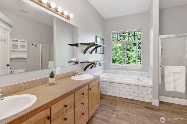 1055 Falls Dr, Bellingham, WA 98229 - bathroom featuring a shower stall, double vanity, wood finished floors, and a garden tub