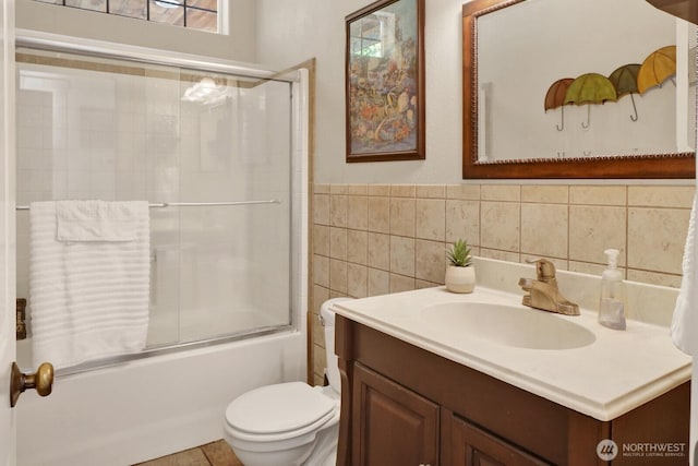 1055 Falls Dr, Bellingham, WA 98229 - full bath with vanity, toilet, bath / shower combo with glass door, and tile walls