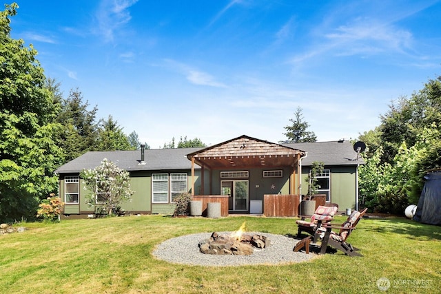 1055 Falls Dr, Bellingham, WA 98229 - rear view of house featuring an outdoor fire pit and a yard