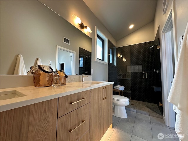 574 Creston Ct, Bellingham, WA 98226 - bathroom featuring double vanity, a stall shower, toilet, vaulted ceiling, and tile patterned floors