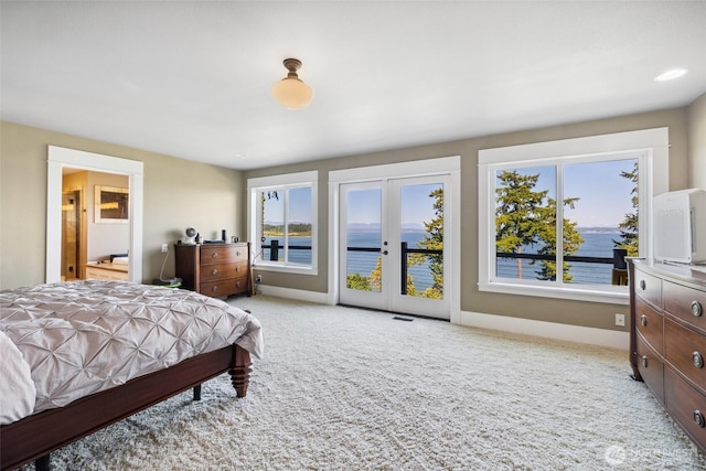 699 Lehman Dr, Camano Island, WA 98282 - bedroom featuring access to outside, french doors, carpet floors, ensuite bathroom, and baseboards