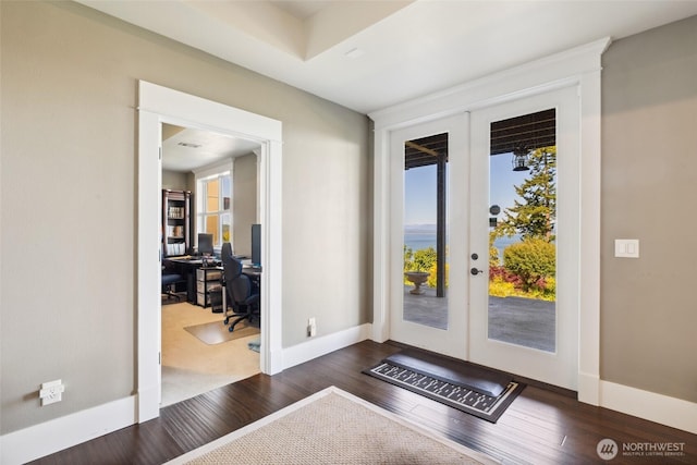699 Lehman Dr, Camano Island, WA 98282 - doorway featuring french doors, a desk, dark wood finished floors, and baseboards