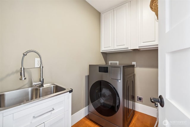 699 Lehman Dr, Camano Island, WA 98282 - laundry room featuring washer / clothes dryer, cabinet space, light wood-type flooring, and baseboards