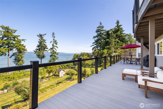 699 Lehman Dr, Camano Island, WA 98282 - wooden terrace with a water view and outdoor dining area