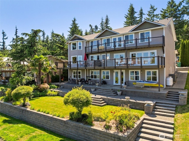 699 Lehman Dr, Camano Island, WA 98282 - rear view of property with a balcony, a patio area, and a yard