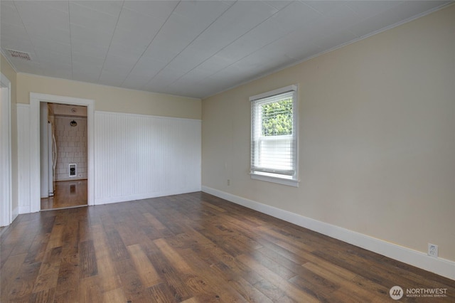 212 Hayes St, Hoquiam, WA 98550 - unfurnished room featuring dark wood finished floors, ornamental molding, and baseboards