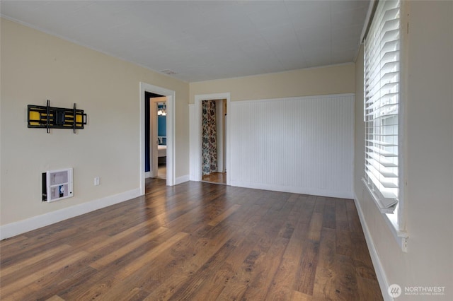 212 Hayes St, Hoquiam, WA 98550 - empty room with wood finished floors, baseboards, and ornamental molding