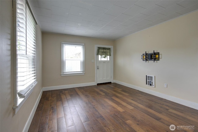 212 Hayes St, Hoquiam, WA 98550 - foyer entrance featuring dark wood-style flooring, baseboards, and heating unit