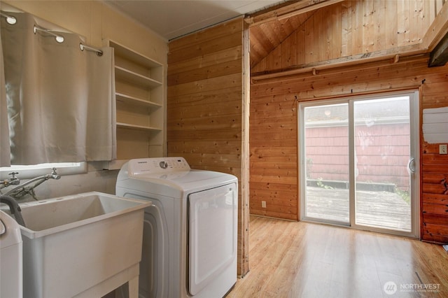 212 Hayes St, Hoquiam, WA 98550 - laundry room featuring washer / clothes dryer, wood walls, and light wood-style flooring
