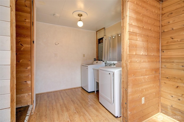 212 Hayes St, Hoquiam, WA 98550 - laundry room with washer / clothes dryer, light wood finished floors, and electric panel
