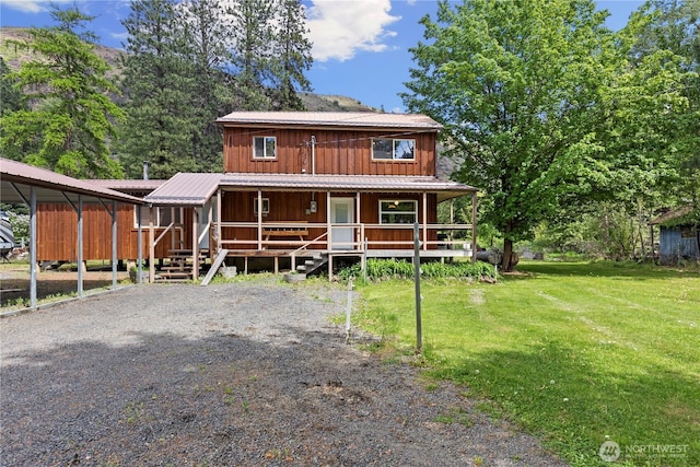51 Deer Meadow Ln, Naches, WA 98937 - rustic home featuring a porch, board and batten siding, and a front yard