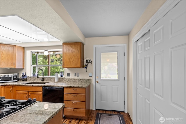 51 Deer Meadow Ln, Naches, WA 98937 - kitchen featuring black dishwasher, a sink, stainless steel microwave, gas stovetop, and wood finished floors