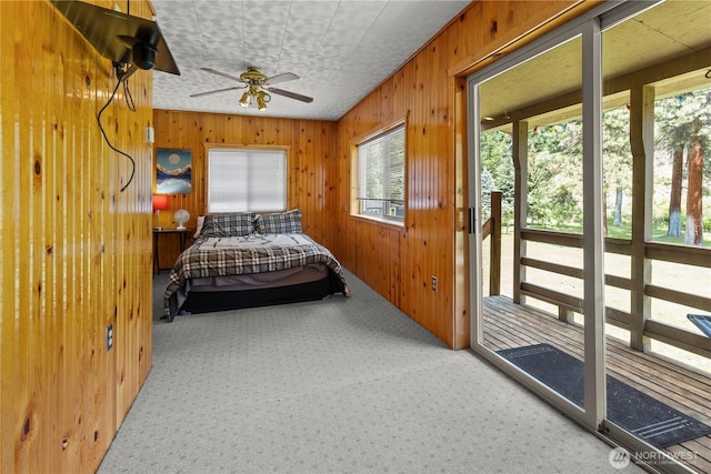 51 Deer Meadow Ln, Naches, WA 98937 - bedroom with carpet floors, wooden walls, and ceiling fan