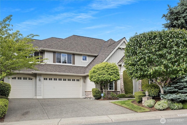25939 SE 22nd Pl, Sammamish, WA 98075 - view of front of home featuring driveway, board and batten siding, an attached garage, stone siding, and a shingled roof