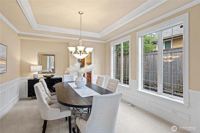 25939 SE 22nd Pl, Sammamish, WA 98075 - dining area with a chandelier, light carpet, a wainscoted wall, crown molding, and a tray ceiling