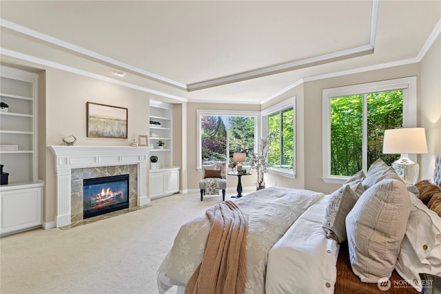 25939 SE 22nd Pl, Sammamish, WA 98075 - bedroom with multiple windows, a high end fireplace, carpet flooring, crown molding, and a tray ceiling