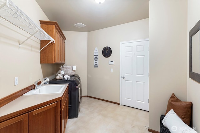 25939 SE 22nd Pl, Sammamish, WA 98075 - laundry room featuring washer and clothes dryer, cabinet space, light flooring, and baseboards