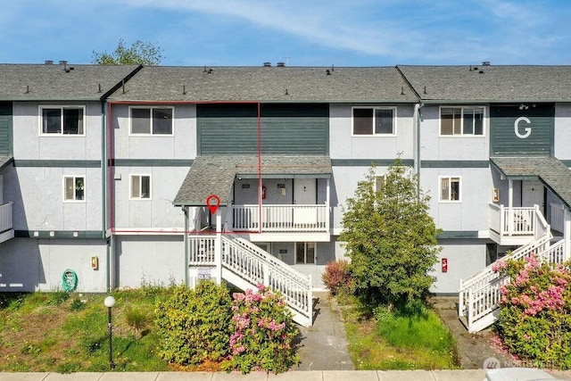 8823 Holly Dr Unit G205, Everett, WA 98208 - view of building exterior featuring stairs