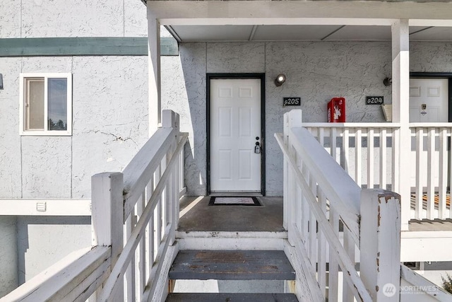 8823 Holly Dr Unit G205, Everett, WA 98208 - property entrance featuring stucco siding
