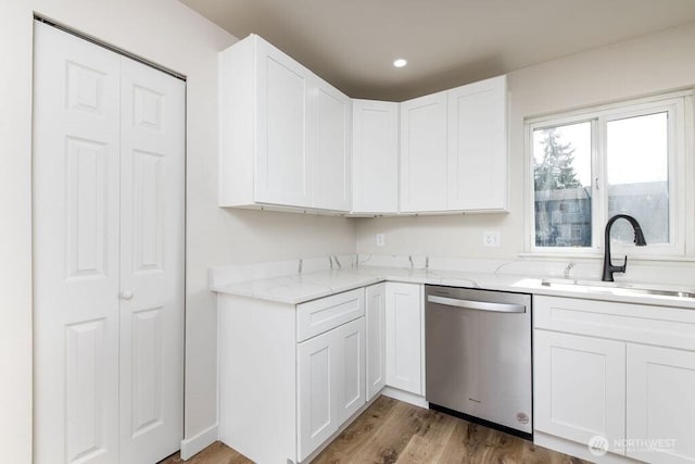 8823 Holly Dr Unit G205, Everett, WA 98208 - kitchen featuring dishwasher, a sink, light stone countertops, white cabinets, and dark wood finished floors