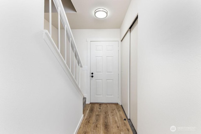 8823 Holly Dr Unit G205, Everett, WA 98208 - hallway featuring stairway and wood finished floors
