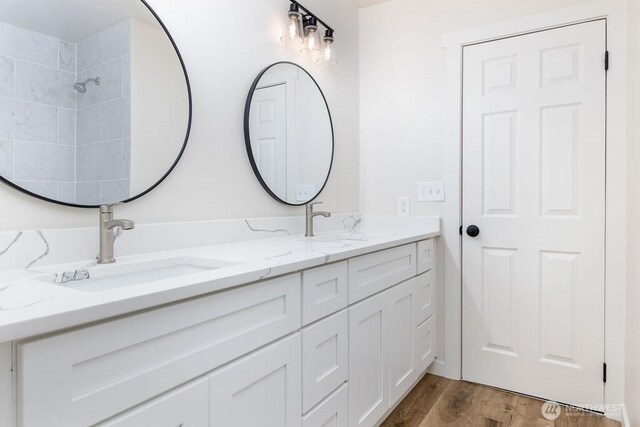 8823 Holly Dr Unit G205, Everett, WA 98208 - full bathroom featuring double vanity and wood finished floors
