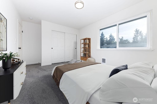 8823 Holly Dr Unit G205, Everett, WA 98208 - carpeted bedroom featuring a closet and baseboards