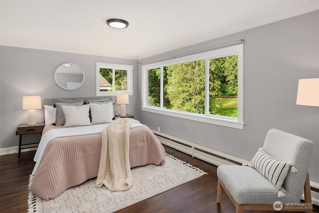 12653 Avondale Rd NE, Redmond, WA 98052 - bedroom featuring baseboard heating, multiple windows, baseboards, wood finished floors, and crown molding